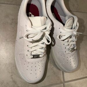 Nike Air Force 1 White Sneakers with Silver Accents